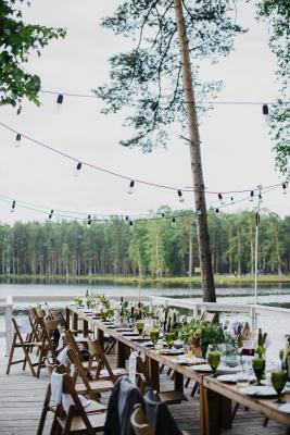 banquet-wooden-table-and-chairs-on-terrace-near-lake-3951652.jpg